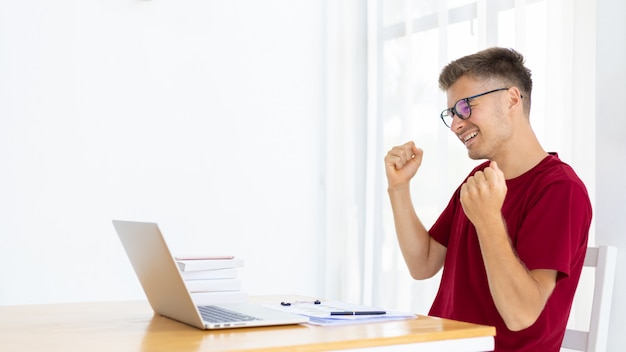 Man working from home in modern white room