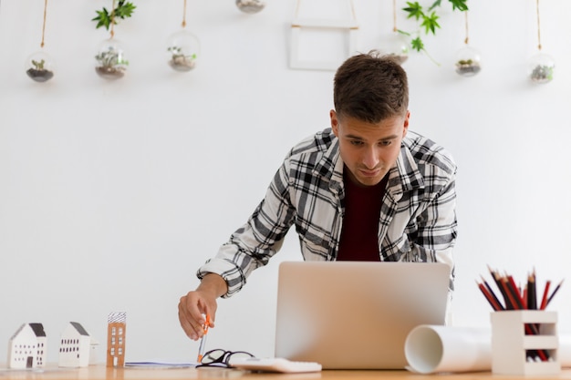 Man working from home in modern white room