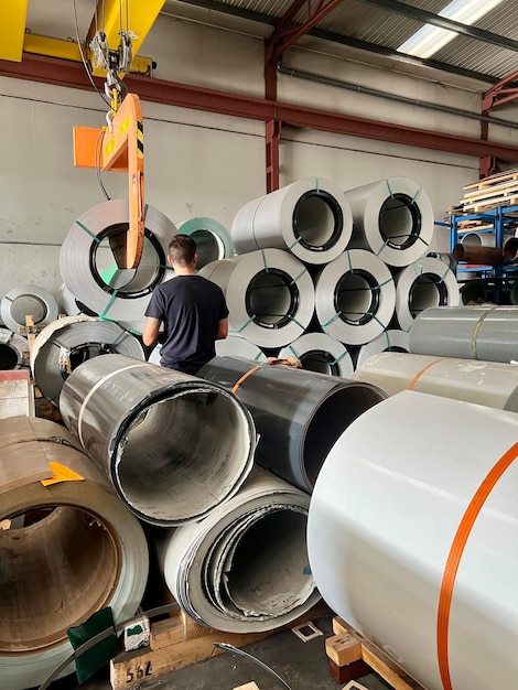 Man working in a metal coil industry Worker person in a metal coil industry