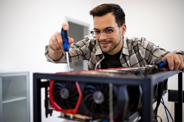 Man working on new bitcoin mining rig