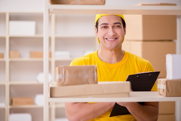 Man working in postal parcel delivery service office