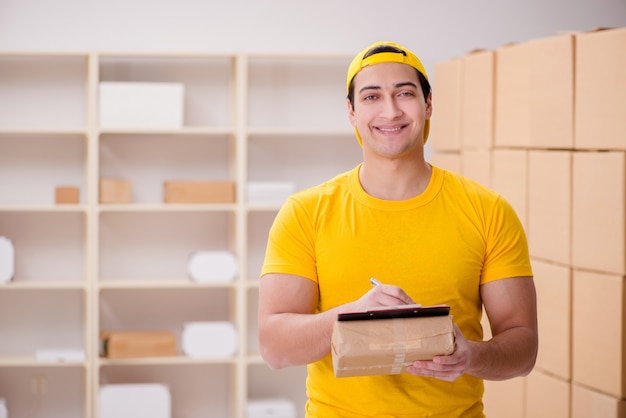 Man working in postal parcel delivery service office