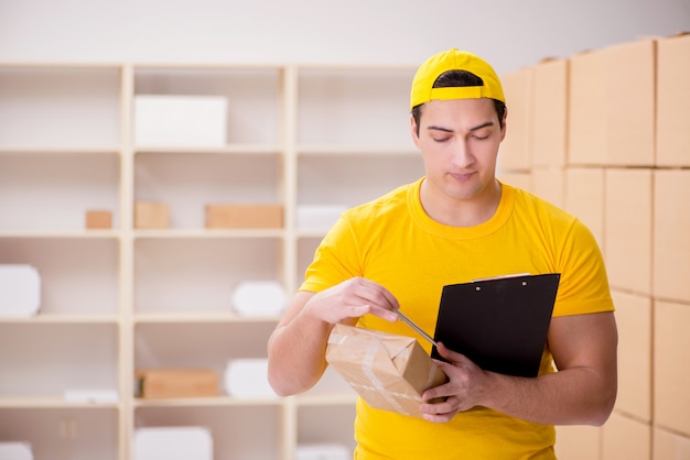 Man working in postal parcel delivery service office