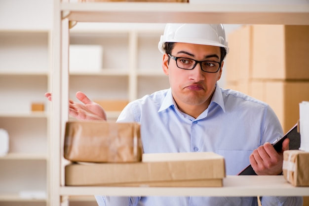 Man working in postal parcel delivery service office