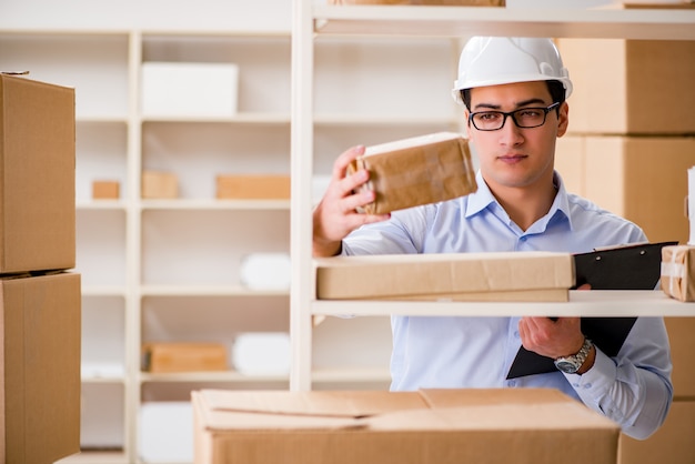 Man working in postal parcel delivery service office