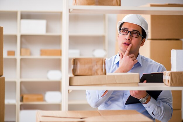 Man working in postal parcel delivery service office