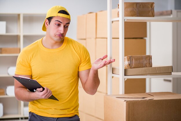 Man working in postal parcel delivery service office