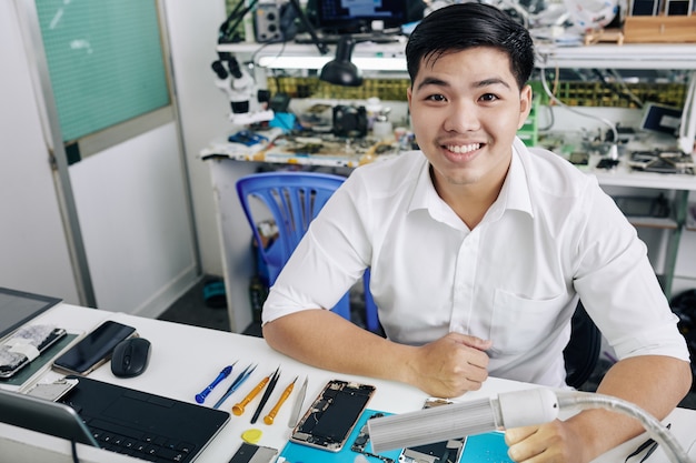 Man working at smartphone repair shop