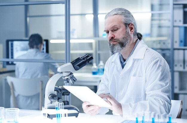 Man working on tablet pc at lab