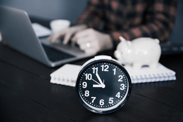 Man working with clock on desk