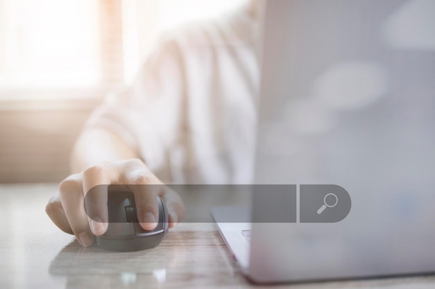 Man working with computer laptop searching browsing internet data