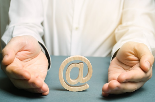 man wraps his hands around an e-mail and internet