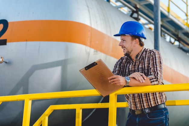 Man writing notes in the factory