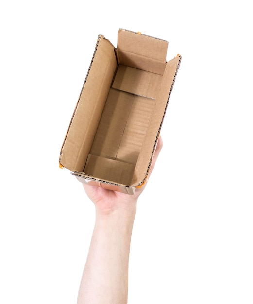 Man39s arm raised holding a cardboard box Recycling concept Isolate on white background