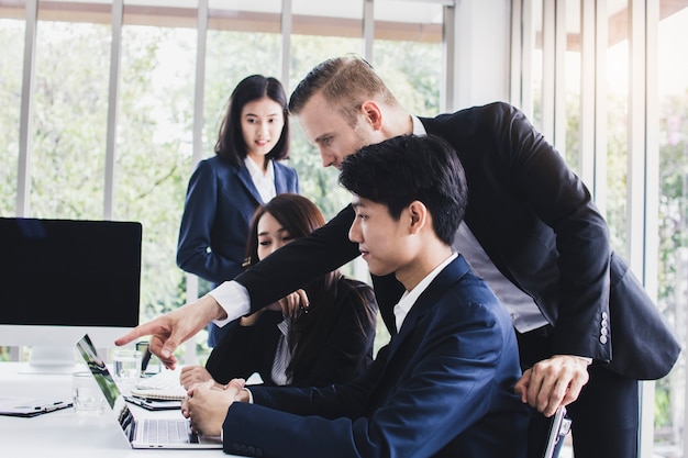 Manager or boss looking at work and admire by showing thumb for good job 