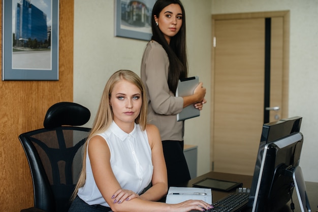 The Manager and his assistant discuss new plans and tasks. Business, Finance