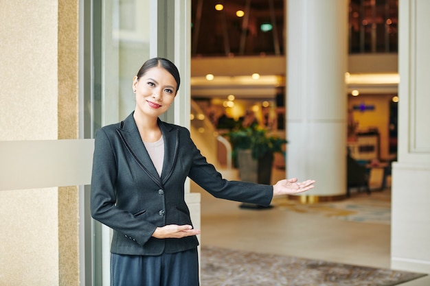 Manager inviting to the hotel