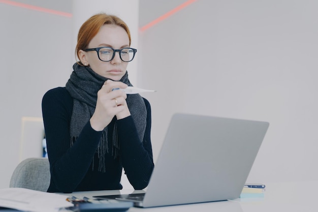 Manager is sick Young white woman in glasses has high temperature Unwell businesswoman