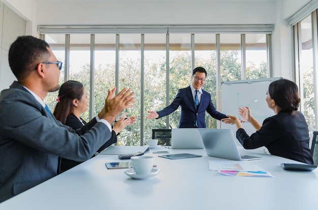 Manager meeting with team work in office