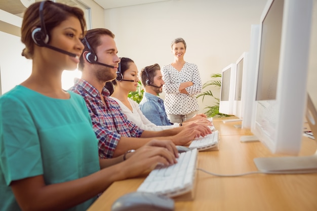 Manager supervising work in call center