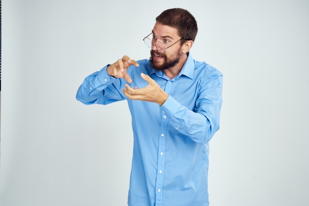 Manager wearing glasses posing office work light background