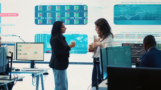 Managers collecting important statistics numbers on a big screen