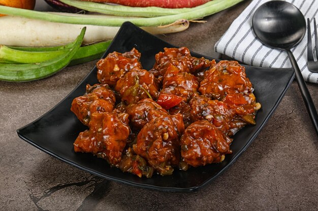 Manchurian chicken with sauce and spices