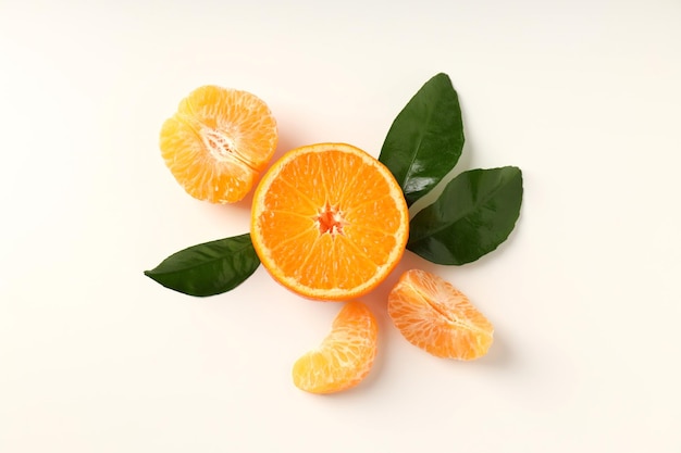 Mandarin with leaves on white background top view