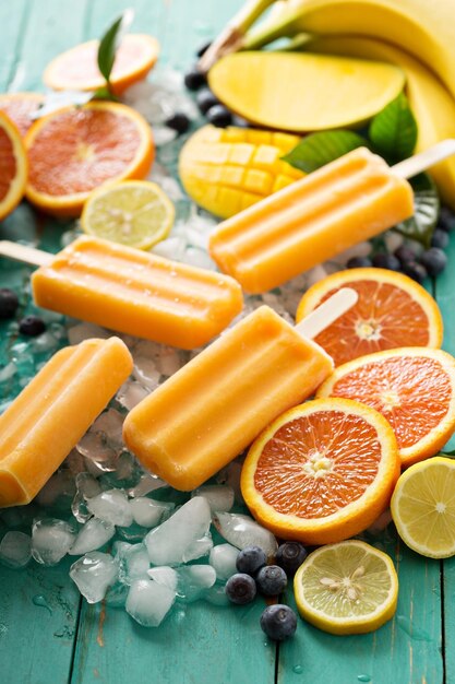 Mango banana popsicles on ice