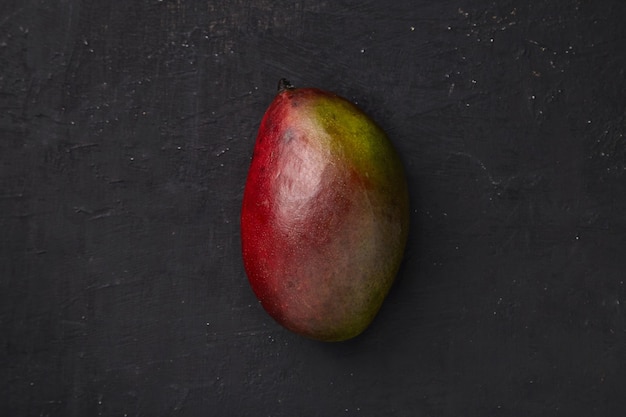 Mango on a dark textured 