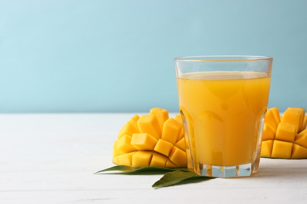 Mango juice in a glass and mango fruit