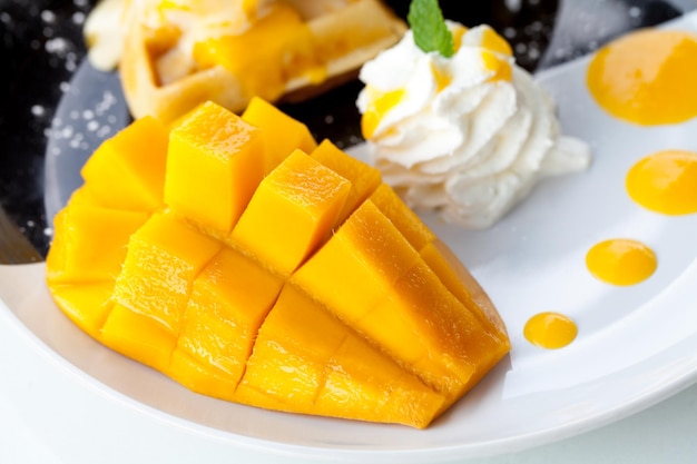 Mango and waffles with ice cream