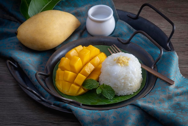 Mango with sticky rice is popular traditional dessert of thailand