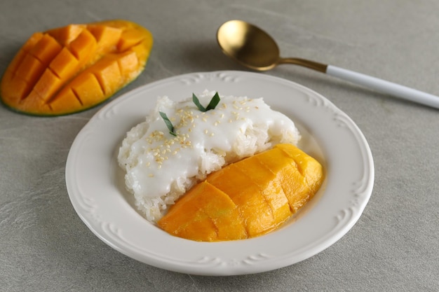 mango with sticky rice is a typical Thai dessert made from glutinous rice and coconut milk sauce.