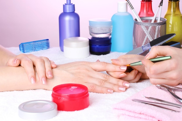 Manicure process in beautiful salon