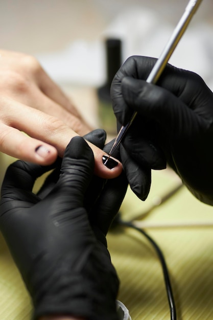 manicurist makes a manicure The process of creating a quality manicure Personal care