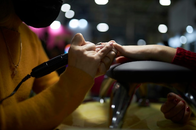 manicurist makes a manicure The process of creating a quality manicure Personal care