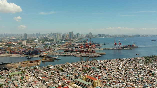 Manila city with port skyscrapers modern buildings and makati business center aerial drone travel va