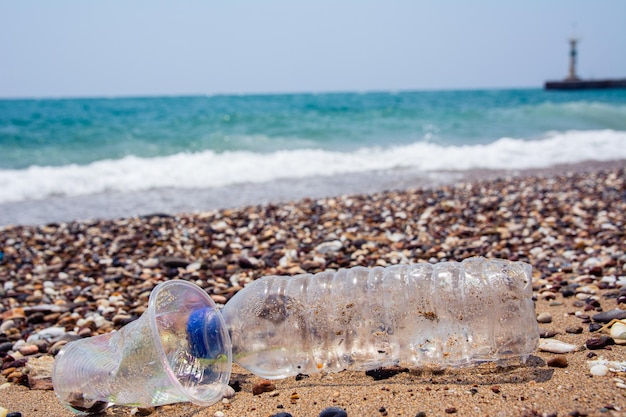 A manmade garbage in the sea plastic bottles glasses and other plastic