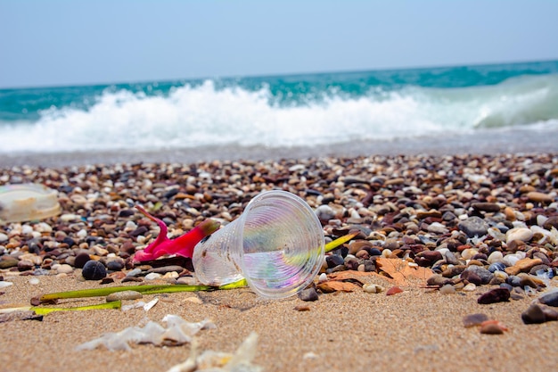 A manmade garbage in the sea plastic bottles glasses and other plastic