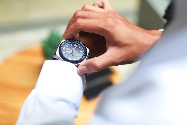 Mans watch on hand Wedding ceremony