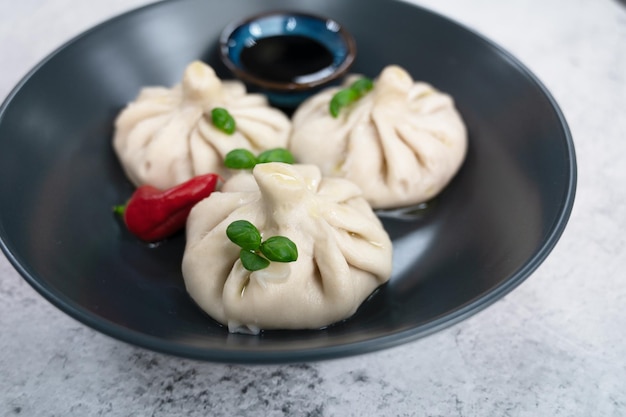 Manti on a plate traditional asian food stuffed with meat and vegetables