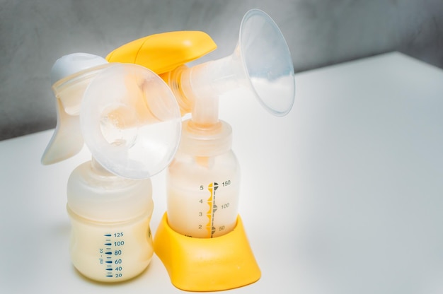 Manual and electric breast pump closeup Breast milk Breastfeeding