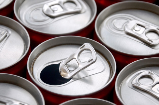 Many aluminium soda drink cans. Advertising for Soda drinks or tin cans mass manufacturing