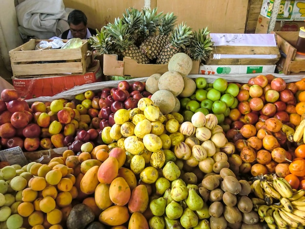 Many assorted fruits for sale in a market in Peru.