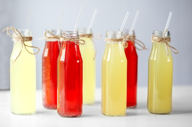 Many bottles of lemonade with straws Concept of drinks summer bar rest healthy food