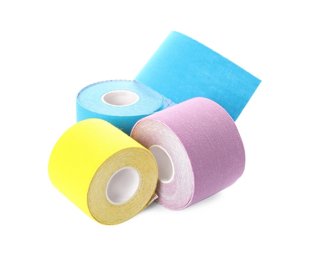 Many bright kinesio tape in rolls on white background