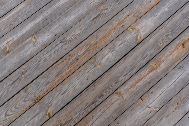 Many brown natural weathered wood plank wall texture background in angle