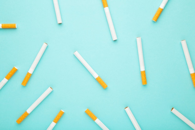 Many cigarettes on a blue background