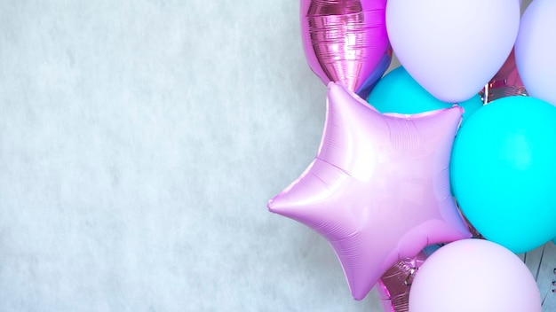 Many colorful balloons on a light background